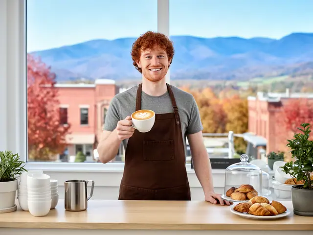 A café owner holding a latte with heart art.